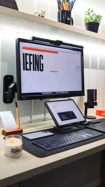 A contemporary workspace showcasing a laptop, tablet, and smartphones, ideal for tech and freelance use.